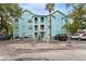 Charming three-story building with a light blue exterior and well-maintained parking lot at 3002 W Cleveland St # D4, Tampa, FL 33609