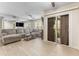 Bright living room featuring a comfortable sectional sofa, ceiling fans, and sliding door to patio at 3002 W Cleveland St # D4, Tampa, FL 33609