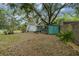 Spacious backyard with a garage and sheds for storing equipment at 3018 Pemberton Trace Ct, Plant City, FL 33565