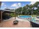 Backyard patio with pool, seating area, and gazebo at 3018 Pemberton Trace Ct, Plant City, FL 33565