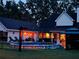 Inviting backyard with pool, gazebo and covered patio perfect for entertaining and relaxation after sunset at 3018 Pemberton Trace Ct, Plant City, FL 33565