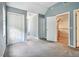 Bedroom with carpet, closets, neutral walls, and access to other rooms at 3018 Pemberton Trace Ct, Plant City, FL 33565
