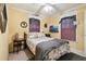 Bedroom featuring natural light, a ceiling fan, and a bed with patterned bedding at 3018 Pemberton Trace Ct, Plant City, FL 33565