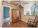 Inviting bonus room with vaulted ceilings, wood floors, and a peaceful rocking chair by the window at 3018 Pemberton Trace Ct, Plant City, FL 33565