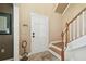 Inviting entryway features tile flooring, stairs, and a stylish front door creating a warm and welcoming atmosphere at 3018 Pemberton Trace Ct, Plant City, FL 33565