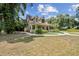 Charming two-story home with a welcoming front porch and well-manicured landscaping, showcasing curb appeal at 3018 Pemberton Trace Ct, Plant City, FL 33565