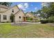 Charming home with landscaped yard, and driveway leading to an RV at 3018 Pemberton Trace Ct, Plant City, FL 33565