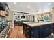 Kitchen island with cooktop and seating, opening to the living area, perfect for entertaining at 3018 Pemberton Trace Ct, Plant City, FL 33565