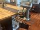 Custom kitchen island features a pull-out shelf for an electric mixer, adding functionality and convenience at 3018 Pemberton Trace Ct, Plant City, FL 33565