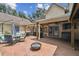 Backyard patio with an outdoor kitchen, fire pit and seating area at 3018 Pemberton Trace Ct, Plant City, FL 33565