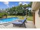 Relaxing backyard with pool and lounge chairs on the deck at 3018 Pemberton Trace Ct, Plant City, FL 33565