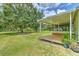 Expansive back yard features a deck area and mature shade trees at 3203 21St Se Ave, Ruskin, FL 33570