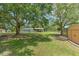 Expansive backyard with mature trees, sheds, and plenty of space for outdoor enjoyment at 3203 21St Se Ave, Ruskin, FL 33570
