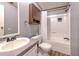 Bathroom featuring a tub and shower combination and a single sink vanity with grey walls at 3203 21St Se Ave, Ruskin, FL 33570