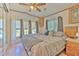 Comfortable bedroom with a large bed, soft lighting, and natural light from windows at 3203 21St Se Ave, Ruskin, FL 33570