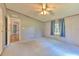 Comfortable bedroom featuring a ceiling fan, neutral walls, and natural light from the window at 3203 21St Se Ave, Ruskin, FL 33570