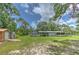 Sprawling green lawn and various outbuildings make this property a great place to enjoy the outdoors at 3203 21St Se Ave, Ruskin, FL 33570
