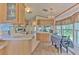 Bright kitchen featuring wooden cabinetry, countertops and a dining table at 3203 21St Se Ave, Ruskin, FL 33570