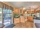 Open kitchen area with wood cabinets, modern appliances, and sliding glass door at 3203 21St Se Ave, Ruskin, FL 33570