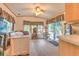 View of living space with wood flooring and a sliding glass door and large windows at 3203 21St Se Ave, Ruskin, FL 33570