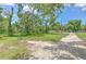 Residential lot with basketball hoop and mature trees at 3203 21St Se Ave, Ruskin, FL 33570