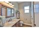 Bright bathroom with granite countertop, vanity, and decor at 3212 E Merrin Rd, Plant City, FL 33567