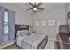Bedroom featuring a ceiling fan, window with natural light, and neutral decor at 3212 E Merrin Rd, Plant City, FL 33567