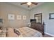 Bedroom with a ceiling fan, dresser, and artwork at 3212 E Merrin Rd, Plant City, FL 33567