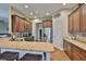 Open concept kitchen boasts granite countertops, stainless steel appliances, and ample cabinet space at 3212 E Merrin Rd, Plant City, FL 33567