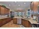 Beautiful kitchen features granite countertops, stainless steel appliances, and wood cabinetry at 3212 E Merrin Rd, Plant City, FL 33567