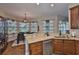 Bright kitchen showcases granite counters, stainless appliances, and a charming breakfast nook with large windows at 3212 E Merrin Rd, Plant City, FL 33567