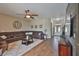 Elegant living room with wood-look tile, an oversized sectional, and attractive decor at 3212 E Merrin Rd, Plant City, FL 33567