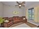 Comfortable media room with theater seating, ceiling fan, and a relaxing ambiance at 3212 E Merrin Rd, Plant City, FL 33567
