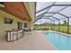Enjoy the enclosed pool, complete with an outdoor bar and ample seating at 3212 E Merrin Rd, Plant City, FL 33567