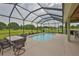 This screened pool and patio offer a luxurious outdoor dining area at 3212 E Merrin Rd, Plant City, FL 33567