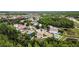 An aerial shot of well-maintained homes, nestled in a community surrounded by verdant trees and green spaces at 3305 Hoylake Ct, Land O Lakes, FL 34638