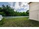 A serene backyard with a white fence and lush greenery provides privacy at 3305 Hoylake Ct, Land O Lakes, FL 34638