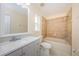 Clean bathroom featuring a vanity with a sink, a toilet, and a tiled bathtub/shower combo at 3305 Hoylake Ct, Land O Lakes, FL 34638