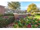 Beautiful community entrance with Ballantrae Park sign, colorful flowers, and well-kept landscaping at 3305 Hoylake Ct, Land O Lakes, FL 34638
