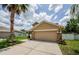 Attractive home with stone accents, two car garage, and manicured lawn at 3305 Hoylake Ct, Land O Lakes, FL 34638