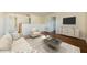 The loft features a modern interior design, including a couch, chair, and entertainment stand with a TV at 3305 Hoylake Ct, Land O Lakes, FL 34638