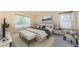 Cozy main bedroom with neutral tones, a large window, and comfortable furnishings at 3305 Hoylake Ct, Land O Lakes, FL 34638