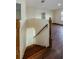 Staircase with wooden steps, railing, and landing leads to a second floor at 3305 Hoylake Ct, Land O Lakes, FL 34638