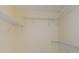 Empty walk-in closet with white wire shelving, ready for personalized organization at 3305 Hoylake Ct, Land O Lakes, FL 34638