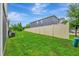 Spacious backyard featuring a privacy fence and lush green grass, perfect for outdoor activities at 3320 Pleasant Willow Ct, Brandon, FL 33511