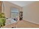 Comfortable bedroom features a dedicated workspace, natural light, and a calming atmosphere for productivity at 3320 Pleasant Willow Ct, Brandon, FL 33511