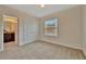Bright bedroom with large window, carpet, closet and bathroom access at 3320 Pleasant Willow Ct, Brandon, FL 33511