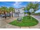 Inviting townhouse showcasing beautiful palm trees, a well-manicured lawn, and convenient parking at 3320 Pleasant Willow Ct, Brandon, FL 33511