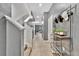 Bright hallway with tiled flooring, neutral paint, and staircase leading to the upper level at 3320 Pleasant Willow Ct, Brandon, FL 33511