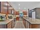 Updated kitchen with stainless steel appliances, granite countertops, and a large island for prep and seating at 3320 Pleasant Willow Ct, Brandon, FL 33511